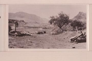 Camp of the LaRue Glen Canyon party at Lees Ferry.  Note the hull of the "Navajo" at left center