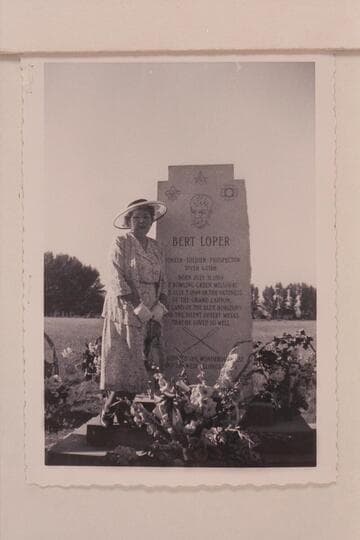 Rachel Loper standing by the monument to Bert Loper at Greenriver, Utah, on the day of the dedication